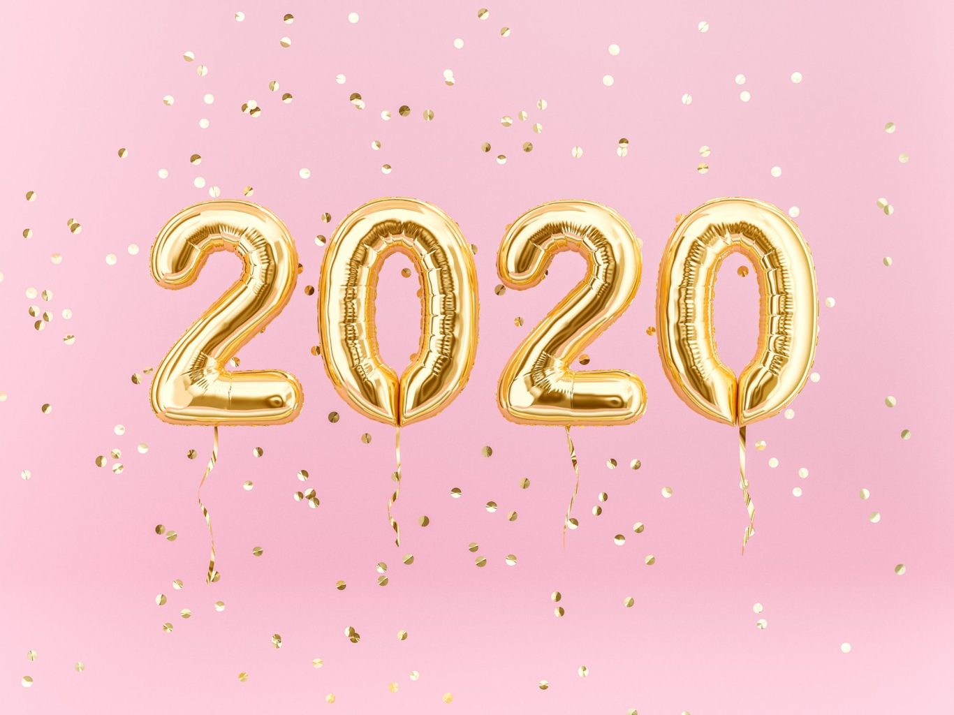 2020 in gold balloons on a pink background