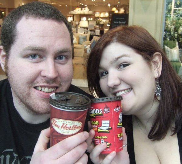 Peter and I posing while holding Tim Hortons coffee cups to our mouths