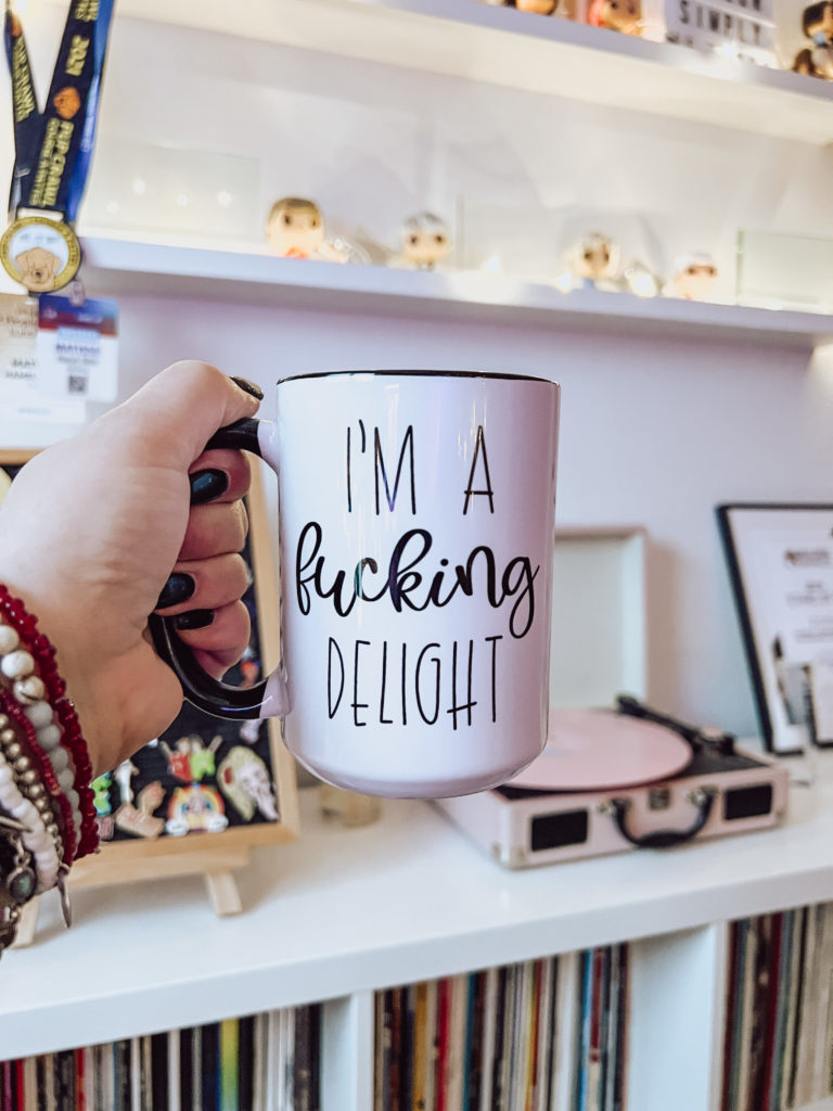 I'm holding up a mug that reads: I'm a fucking delight