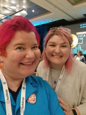 A selfie of Lisa and Matisse smiling, and rocking pink hair, while at the IABC World Conference in Chicago.